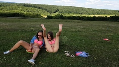 Small titted lesbians from Holland have fun outdoors