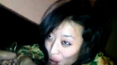 Naughty Vietnamese slut sucks a dark cock