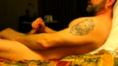 Hairy bear jacking on bed